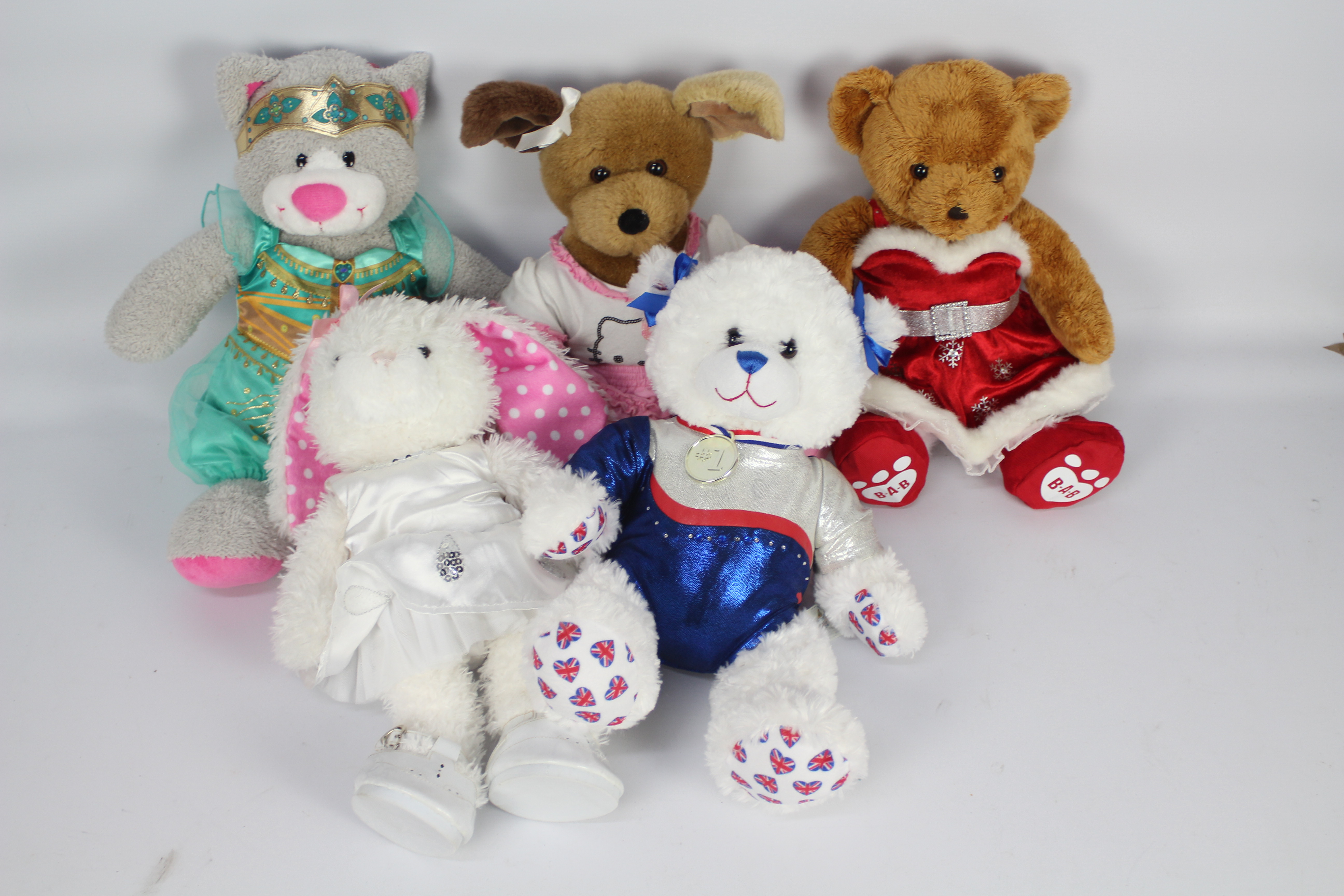 Build-a-Bear - 4 bears + 1 other, to include a brown bear wearing a Christmas dress and red shoes.