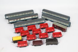 Hornby - A collection of 19 x unboxed OO gauge wagons and coaches including 10 x 7 plank wagons in