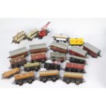 Hornby - A collection of 21 x O gauge tinplate wagons and coaches including 4 x tanker wagons,