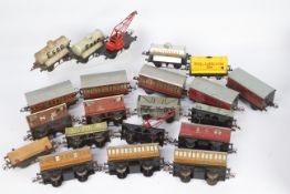 Hornby - A collection of 21 x O gauge tinplate wagons and coaches including 4 x tanker wagons,