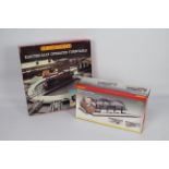 Hornby - A boxed OO gauge Station Terminus # R8009 and a boxed electrically operated Turntable #