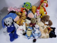 Disney - A collection of 27 x soft toys including Pluto, Eeyore, Piglet, Tigger and more.