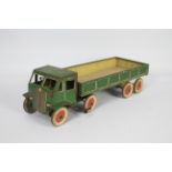 Mettoy - A large clockwork 8 wheel articulated lorry in green with cream lining and Dunlop Fort