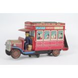 Modern Toys - A battery powered tinplate Type B London Bus model made by Modern Toys in Japan.