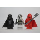 Lego - Star Wars - A limited edition chrome finish Storm Trooper figure also with a Darth Vader