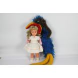 Bella - Emu - A vintage Bella doll with blonde hair and sleeping blue eyes and standing