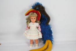 Bella - Emu - A vintage Bella doll with blonde hair and sleeping blue eyes and standing