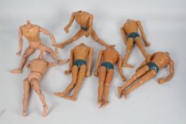 Palitoy, Action Man - Seven naked Action Man figures with various body types.