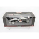 Minichamps - A boxed 1:18 McLaren Mercedes MP4/14 F1 car in David Coulthard livery # 991802.