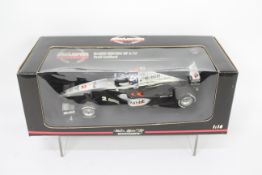 Minichamps - A boxed 1:18 McLaren Mercedes MP4/14 F1 car in David Coulthard livery # 991802.