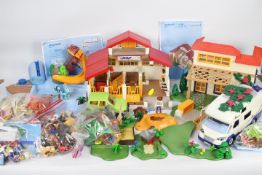 Playmobil - A large quantity of Playmobil items including car, camper van, swimming pool,