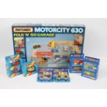 Matchbox - Hot Wheels - A boxed Motorcity 630 Fold 'N' Go Garage # MC630 with 9 x boxed / carded