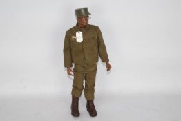 GI Joe, Hasbro - An unboxed vintage black GI.Joe action figure in green fatigues.