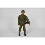 Pedigree, Tommy Gunn - An unboxed Pedigree 'Tommy Gunn' Soldier with Battle Pack.