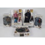 Wizarding World - A collection of 4 x boxed Harry Potter figures and a boxed Harry Potter Puzzle -