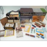 N gauge - a good mixed lot to include 3 x diecast trams, motor vehicles, figures, trackside signals,