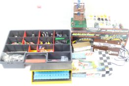 Scalextric - A group of 4 unboxed vintage Scalextric buildings and a boxed C700 Dunlop Bridge ,