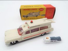 Dinky Toys - a Superior Criterion Ambulance # 263, white body, black base,