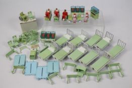 Britains - A collection of Britains Hospital furniture including 10 x beds,