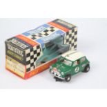 Scalextric - A boxed Scalextric #C7 'Race Tuned' Rally Mini Cooper slot car.