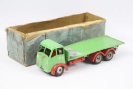 Shackleton - A Shackleton Foden FG flatbed lorry in green with grey chassis and red wheel arches.