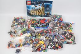 Lego - A mixed lot of various unboxed Lego pieces and characters - Lot includes a Winnie The Poo