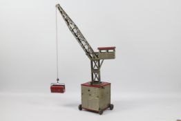 Joustra - A vintage clockwork tinplate mobile crane.