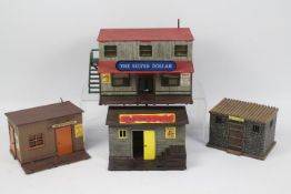 Timpo - A group of four unboxed Wild West themed plastic assembled buildings by Timpo.
