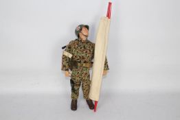 GI Joe, Hasbro, Action Man - An unboxed vintage Hasbro GI Joe action figure in Marine Medic outfit.