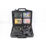 Sega - Mega Drive - A cased Mega Drive Console with two controllers, power leads and 4 games.