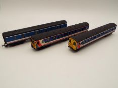 An OO gauge model Southern Pride two car unit op nos 75055 and 76992, and a Lima corridor carriage,