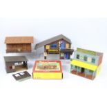 Timpo, Britains - Four unboxed and assembled plastic Wild West themed buildings,