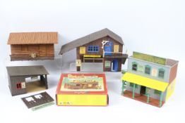 Timpo, Britains - Four unboxed and assembled plastic Wild West themed buildings,