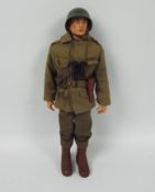 Palitoy, Action Man - A Palitoy Action Man figure in Combat Soldier attire with GI Joe Jacket.