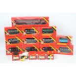 Hornby - A boxed collection of OO gauge rolling stock and track parts.