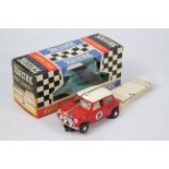 Scalextric - A boxed Scalextric #C7 'Race Tuned' Rally Mini Cooper slot car.