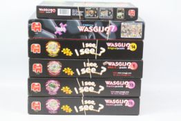 Jumbo, WASGIJ - A boxed collection of WASGIJ mainly 1000 piece jigsaws.