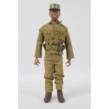 Cotswold Collectables - An unboxed black Action Man type figure by Cotswold Collectables in green
