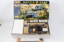 Hornby - A boxed OO gauge Battle Zone train set # T1501 including Class 08 loco and two wagons with