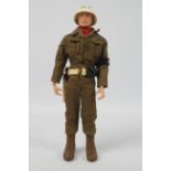 Palitoy, Action Man - A Palitoy red painted hard head Action Man in Military Police outfit.