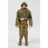 Palitoy, Action Man - A Palitoy blonde painted hard head Action Man in Military Police outfit.