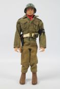 Palitoy, Action Man - A Palitoy blonde painted hard head Action Man in Military Police outfit.