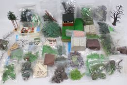 Britains - A large quantity of plastic Garden items including 25 plus trees, 22 x lawn sections,