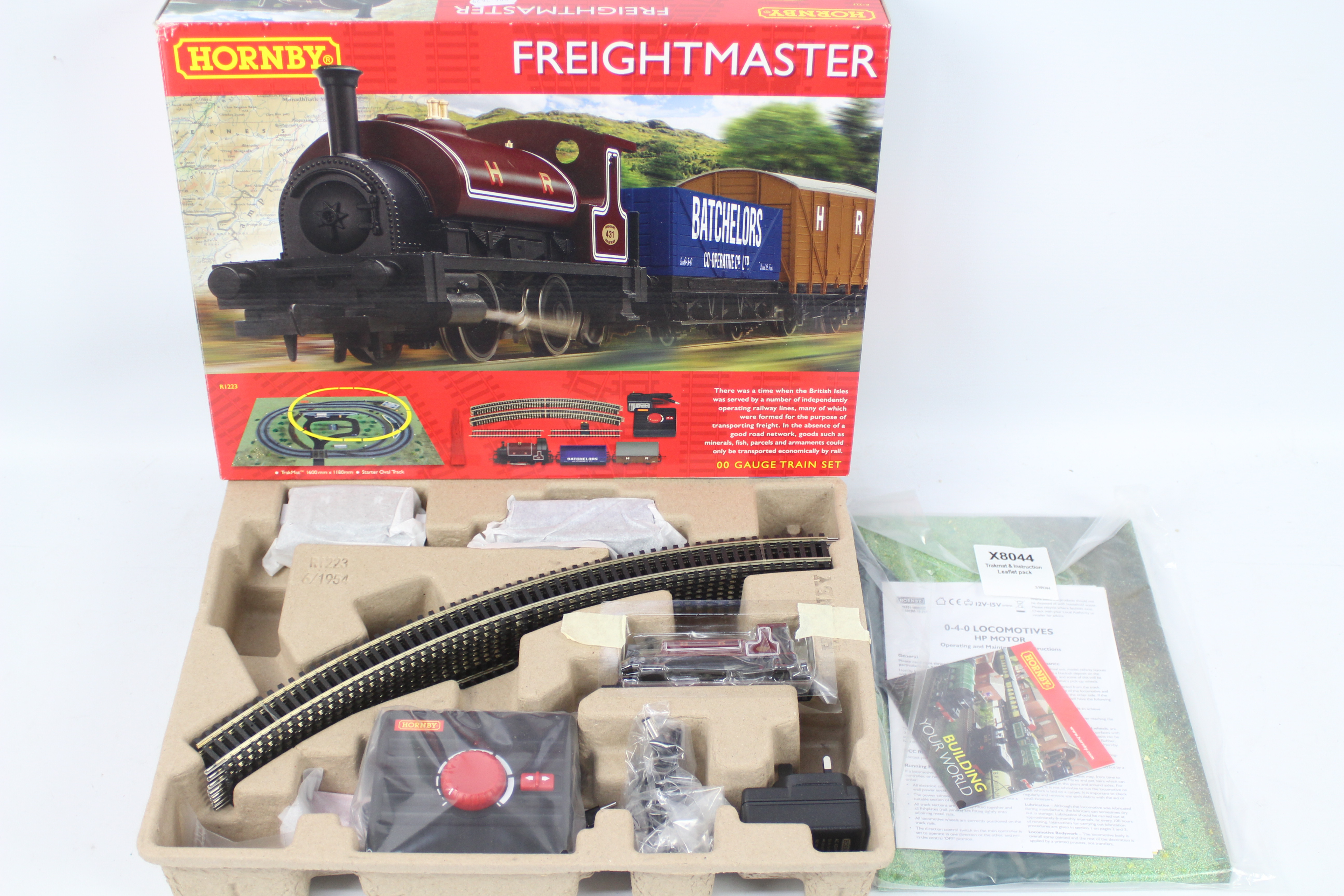 Hornby - A boxed OO gauge Freightmaster set # R1223 with a Saddle Tank loco and two wagons.