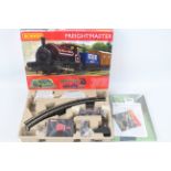 Hornby - A boxed OO gauge Freightmaster set # R1223 with a Saddle Tank loco and two wagons.