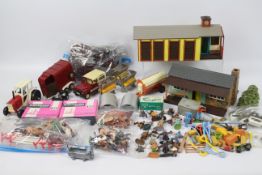 Britains - A collection including Riding Stable, a Wild West building, a quantity of walls, fencing,