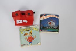 View Master - a View Master with Pinocchio B3111, B3113, B3112, Flintstones B5203, B5202,