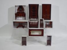 A collection of 10 x boxed pieces of mostly wooden modern doll house furniture - Lot includes a