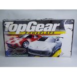Scalextric - A boxed Scalextric Top Gear Power Laps racing set - The #C1218 racing set comes with