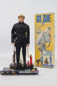 GI Joe, Hasbro - A GI Joe blonde painted hard head figure in State Trooper outfit.